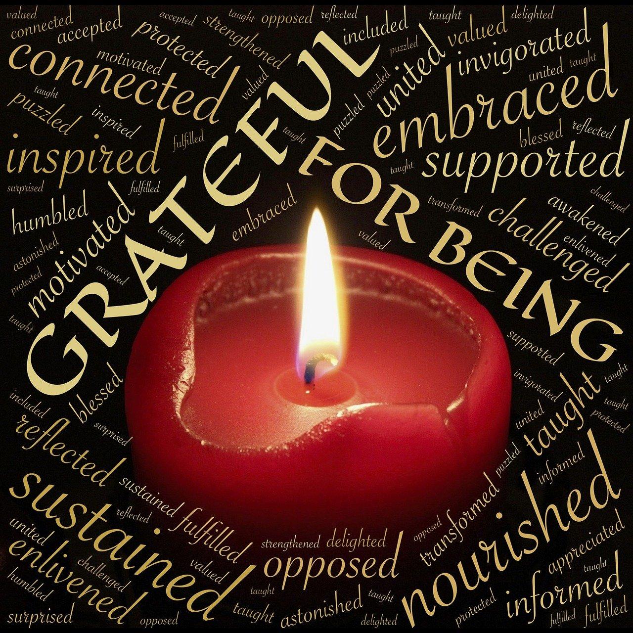 Grateful thanksgiving graphic featuring word art and red candle